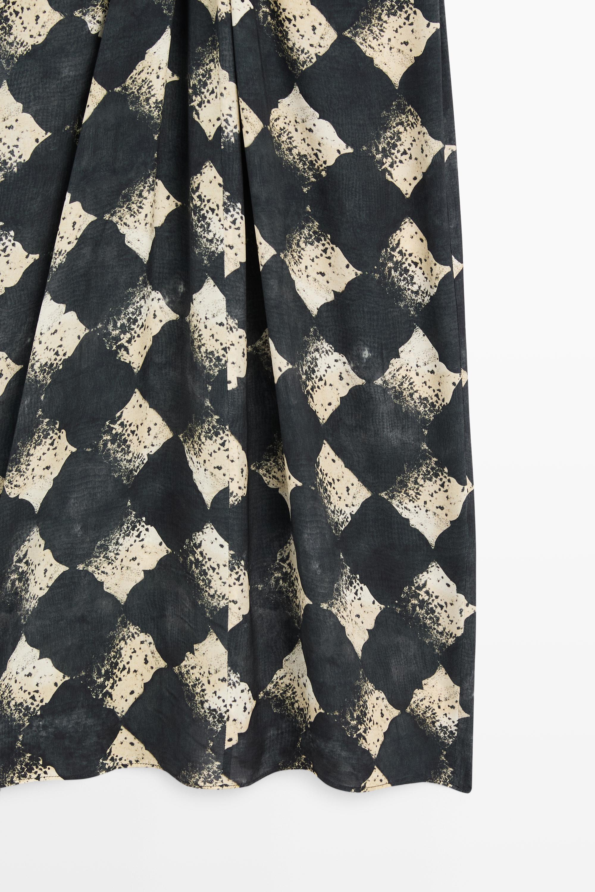 Flowing dress with sash belt detail
